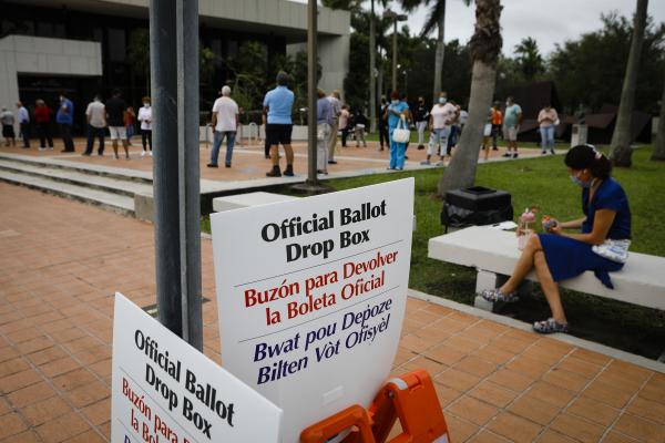 Image from 2020 - Presidential Elections @ Miami, FL - "Offcial ballor drop box" signs are seen at...