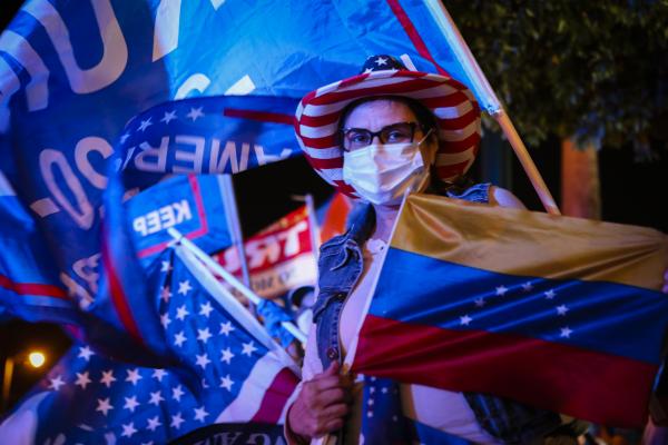 Image from 2020 - Presidential Elections @ Miami, FL - A supporter of President Donald Trump holds a Venezuelan...