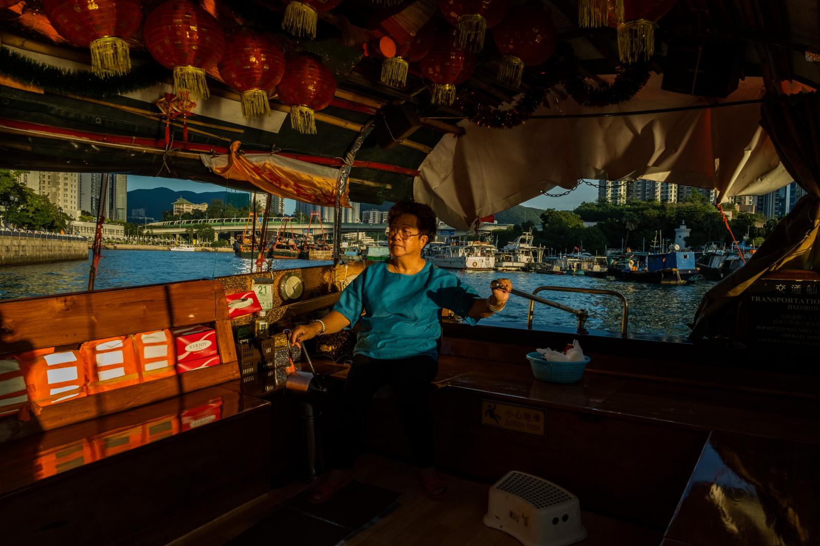 Doris Chu, 68, drives her sampa...deen. Hong Kong, November 2020.