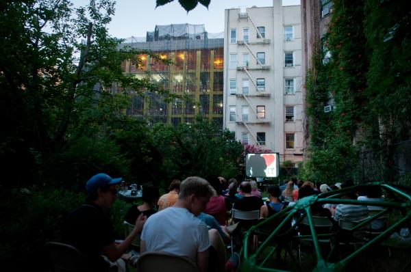 Image from Green Oases in the City - Spectators wait for the screening of a movie during...