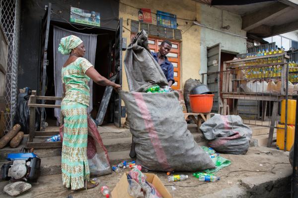Image from Recycling Lagos  - Wecyclers collector Akinsowon Adefemi transfers plastic...