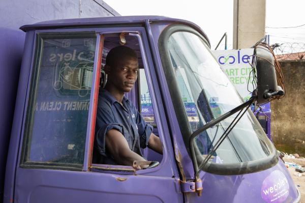 Image from Recycling Lagos  - Wecyclers collector Akinsowon Adefemi sits inside the...