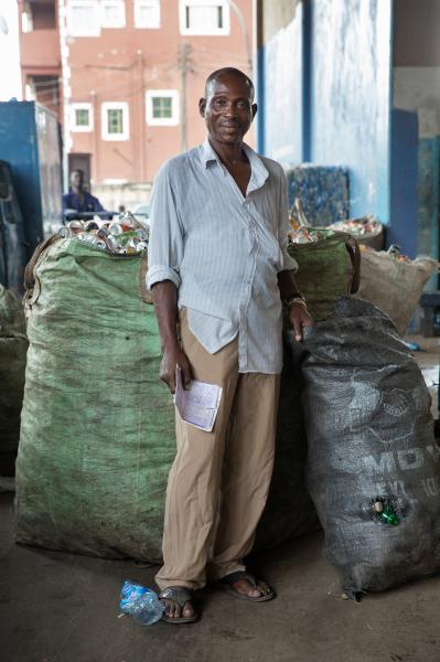 Recycling Lagos  - Remi Olaleye stand in front of the recyclables he has...