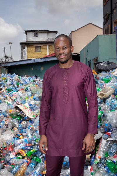 Recycling Lagos  - Wecyclers CEO Wale Adebiyi stands in the courtyard of...