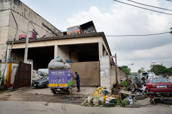 Recycling Lagos  - Wecyclers collector Akinsowon Adefemi parks his vehicle...