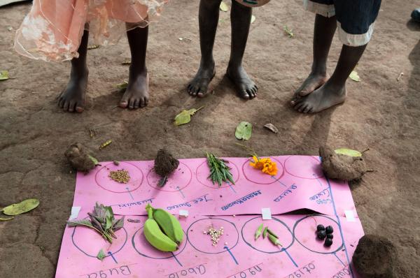 NGO Work - Children learn how to spell names of fruits and...