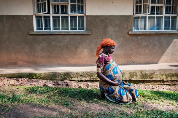 NGO Work - Tumuhimbise Kate rests outside the maternity ward at...