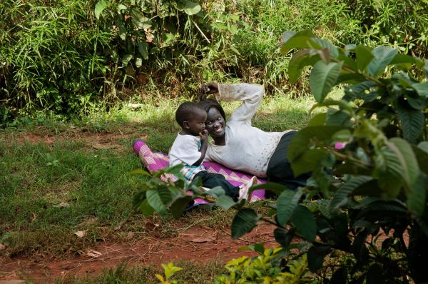 Image from NGO Work - Jacquelyne Mugenyi, HIV positive mother, plays with her...
