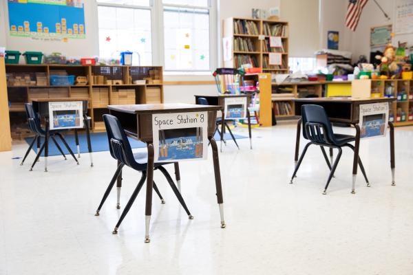 Spaces and Signs (COVID-19) - Desks are spaced six feet apart in the classrooms. Daniel...