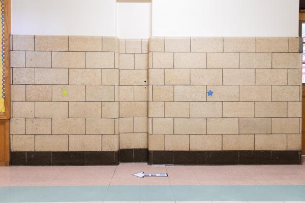 Spaces and Signs (COVID-19) - Arrows on the floor remind students and staff on which...
