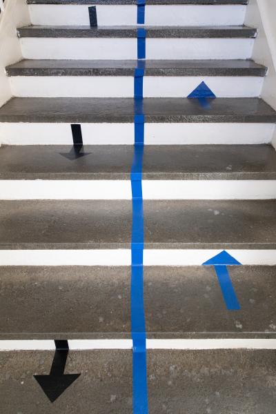 Spaces and Signs (COVID-19) - Arrows on the floor remind students and staff which side...