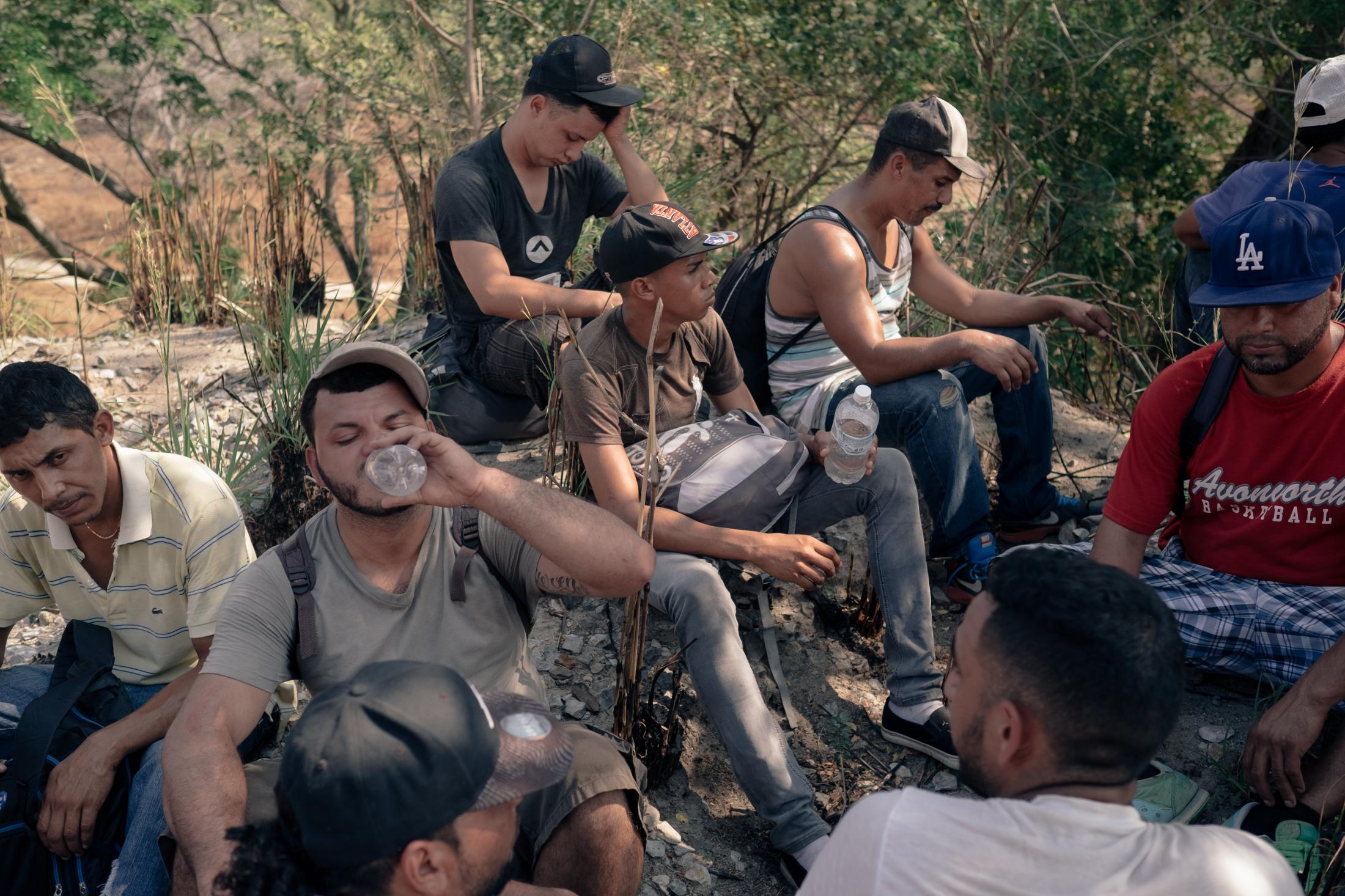 Southern Border - Young migrants resting after having walked about ten...