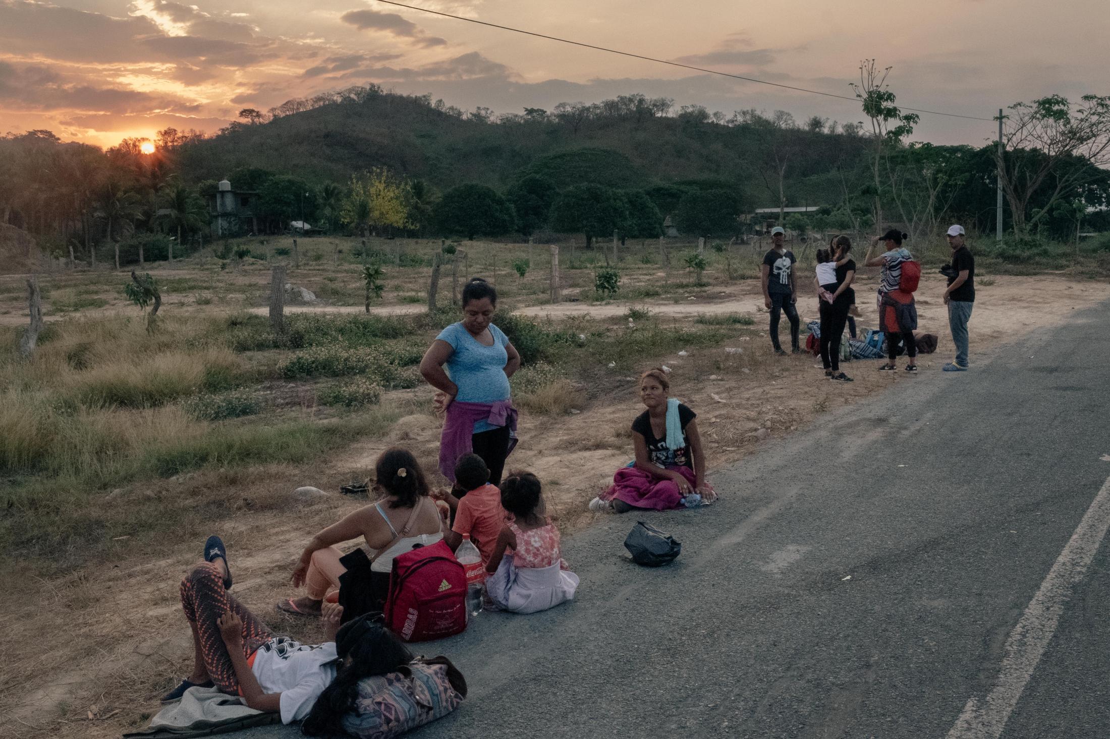 Southern Border - At sunrise, migrants from the caravan rest on the...