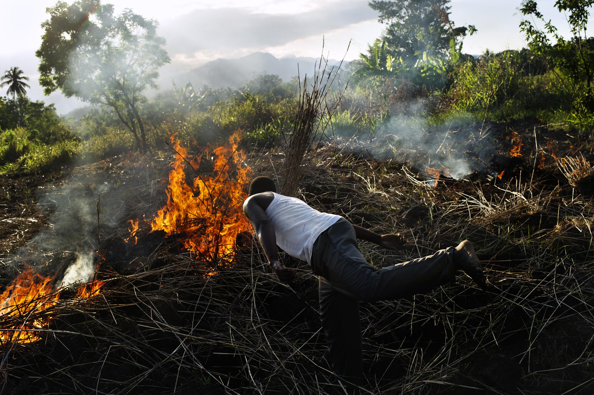 Tanzania, Village Kikundi, Ward Kiroka, Morogoro rural district. A group of neighbours, and their children get togheter to work the land, burning...
