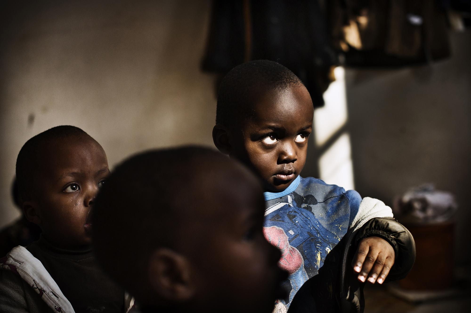 Johannesburg, South Africa. June 2012 Children in the care of Ruth Manyike, who has set up an informal crÃ¨che in one of the slum buildings in the...