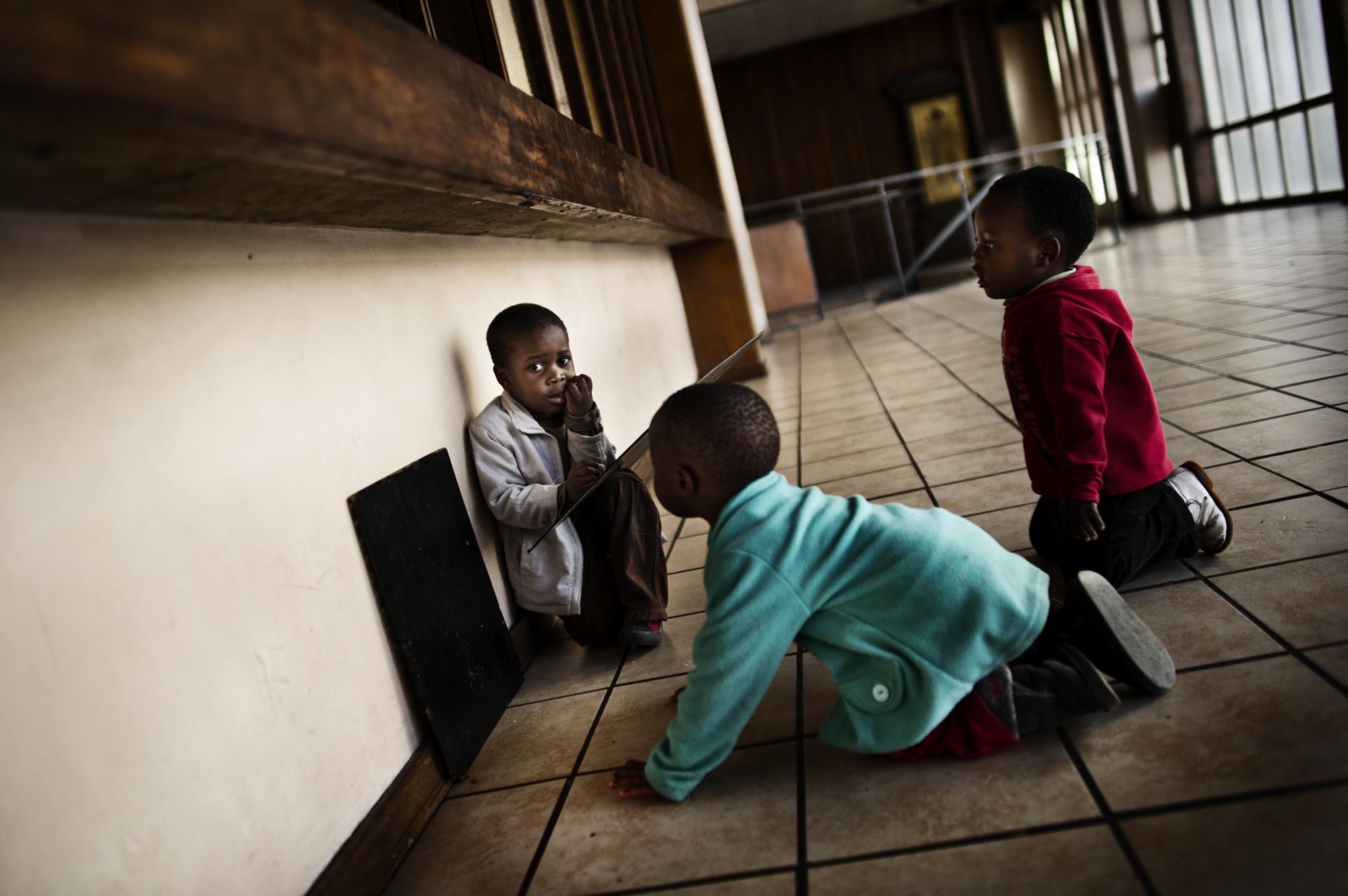 Children of the shadows - Johannesburg, South Africa.June 2012Children playing in...