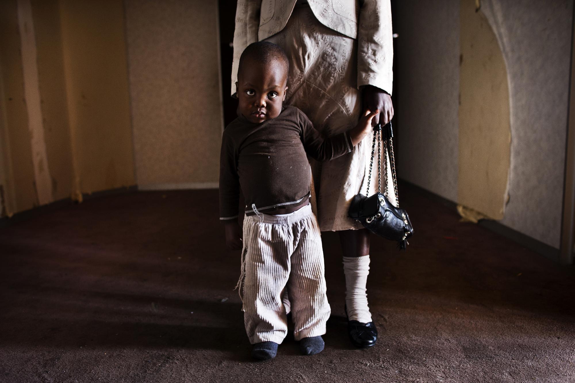 Children of the shadows - Johannesburg, South Africa.June 2012Young boy with his...