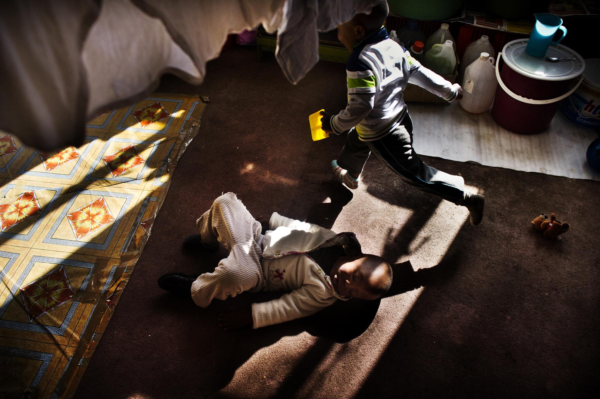 Children of the shadows - Johannesburg, South Africa.June 2012Children playing on...