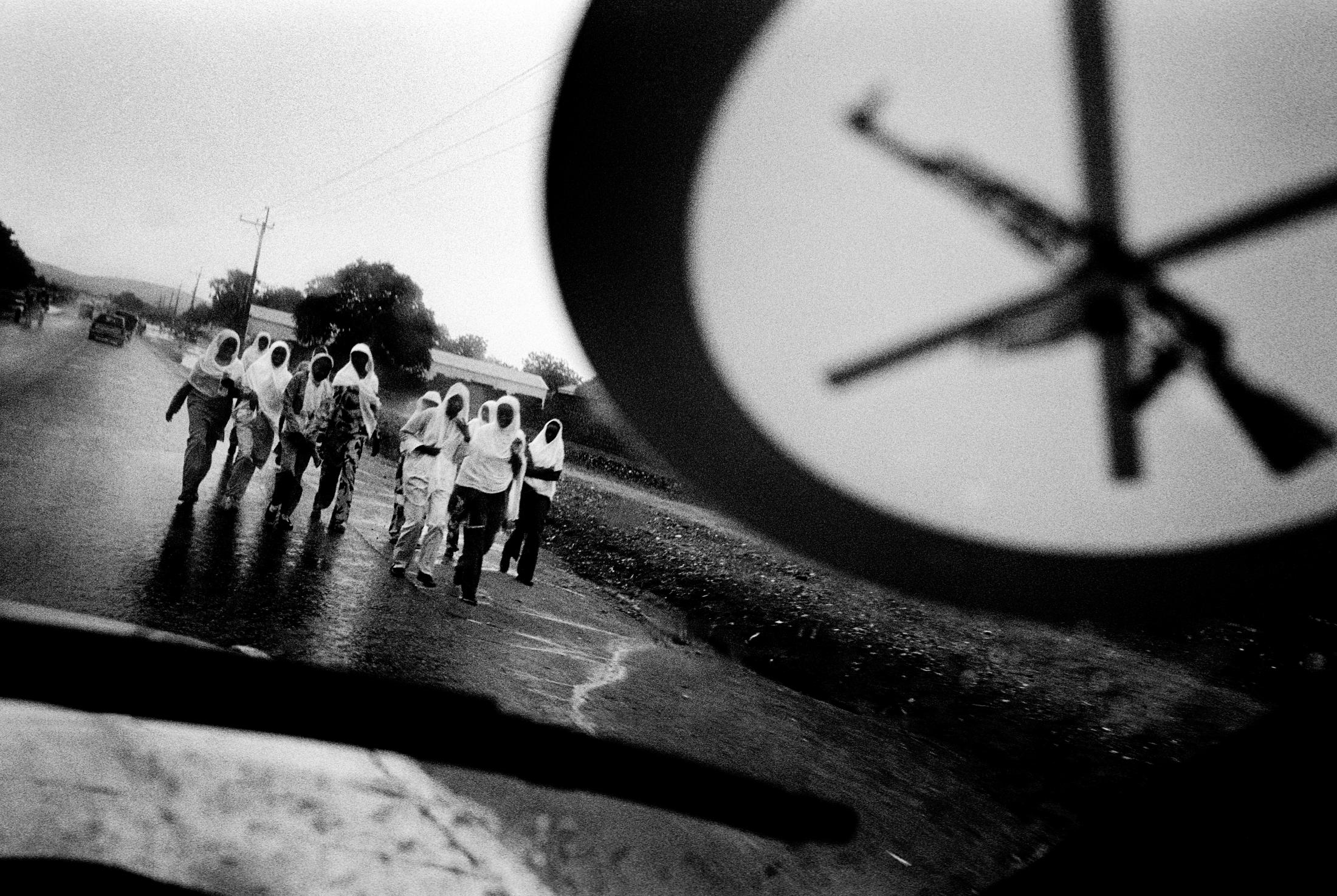Darfur - SUDAN Nyala, South Darfur Women walking home on a rainy...