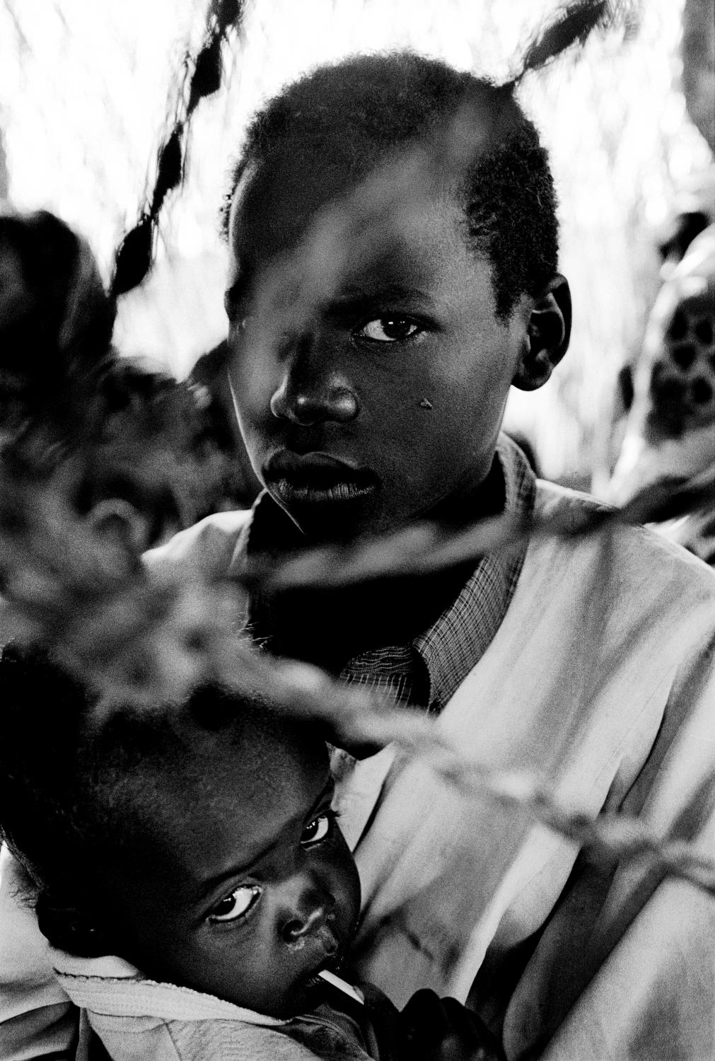 Darfur - SUDAN Zalingei, West Darfur A boy with his sick brother...