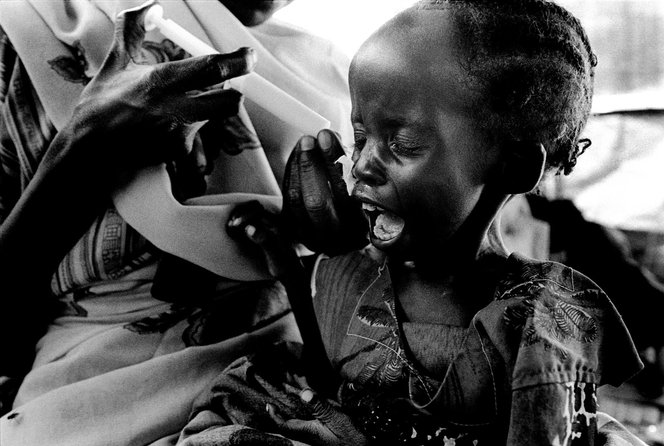 Darfur - SUDAN Nyala, South Darfur Mother with her malnourished...