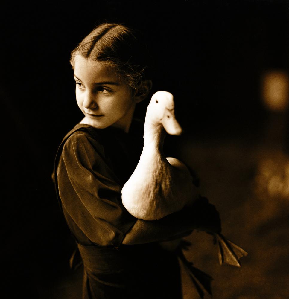  Dorothy and the Duck My Amish neighbor Dorothy and her pet duck. I was visiting the farm to see her father and photograph some of their sheep when the children began showing me their various pets. I asked the father if he minded me taking a few photographs and he agreed.
