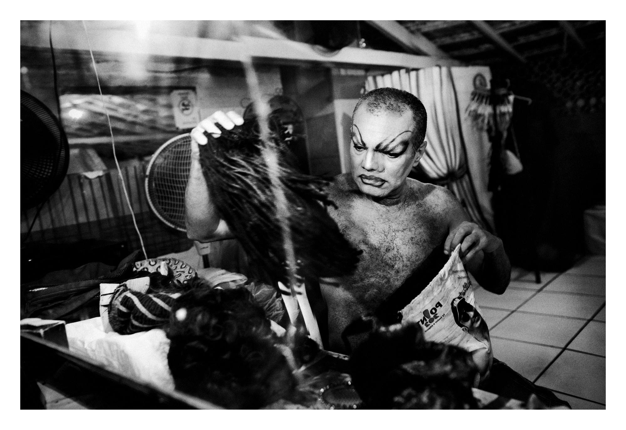 Rio de Janeiro, Brazil. April 2012. "Turma Ok" Club, located in Lapa. Lorna Washington getting ready for a performance. Lorna, precursor of drag queens in Rio de Janeiro, always satirized the Brazilian divas such as Maria Bethania and Elza Soares. Lorna, who is one of the founders of the band Carmen Miranda, witnessed the inauguration of the first spaces used exclusively for the Rio GLS like ï¿½Turma okï¿½ One of his most applauded show was at the club Parrots in the mid-80s, with the direction of Joseph Walter Girï¿½o de Melo. But his success was not limited to Brazil. In 1996, Lorna Washington performed also in the USA. Long before there was any organized gay movement in Brazil, "Turma Ok" was founded in the early 60's in Rio. With almost 50 years of existence, is the oldest gay group in Brazil, and remains active producing cultural events and promoting camaraderie among the participants.