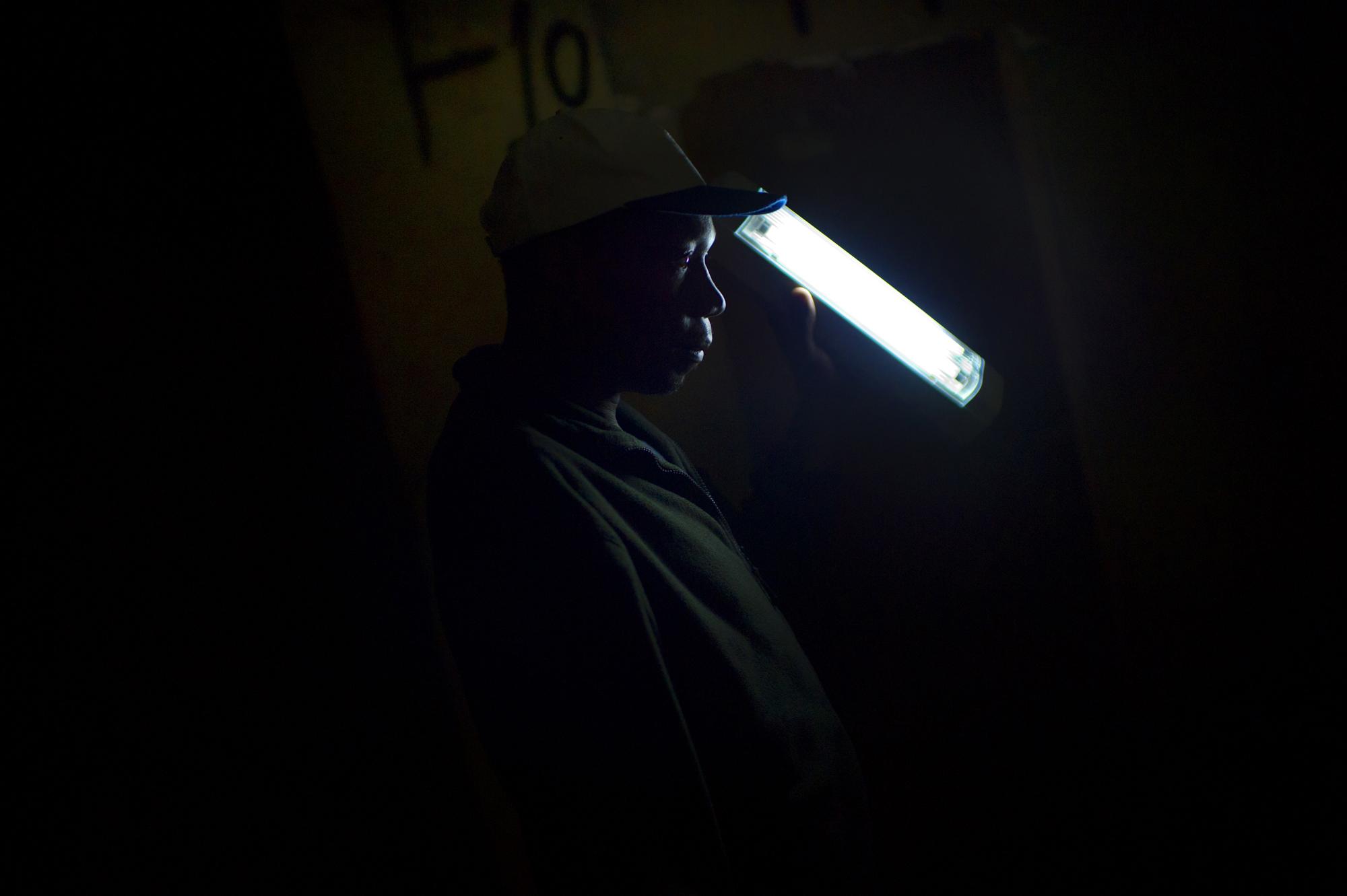 Johannesburg, South Africa. June 2011. An MSF outreach worker in Chambers slum building looking for patients to go downstairs to the mobile clinic....