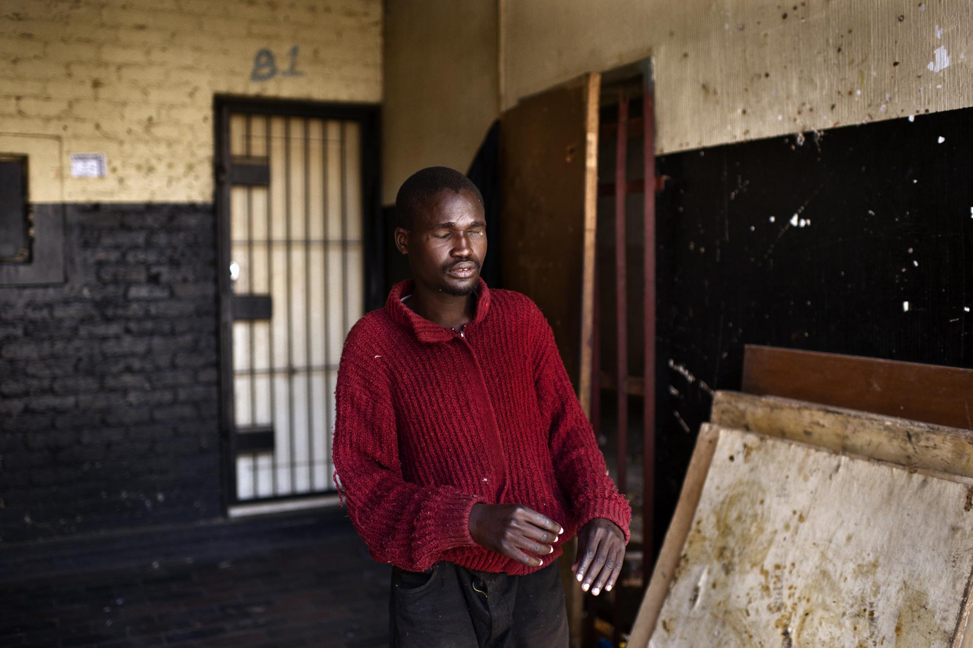 Into the shadows - Johannesburg, South Africa. June 2011. A blind Zimbabwean...