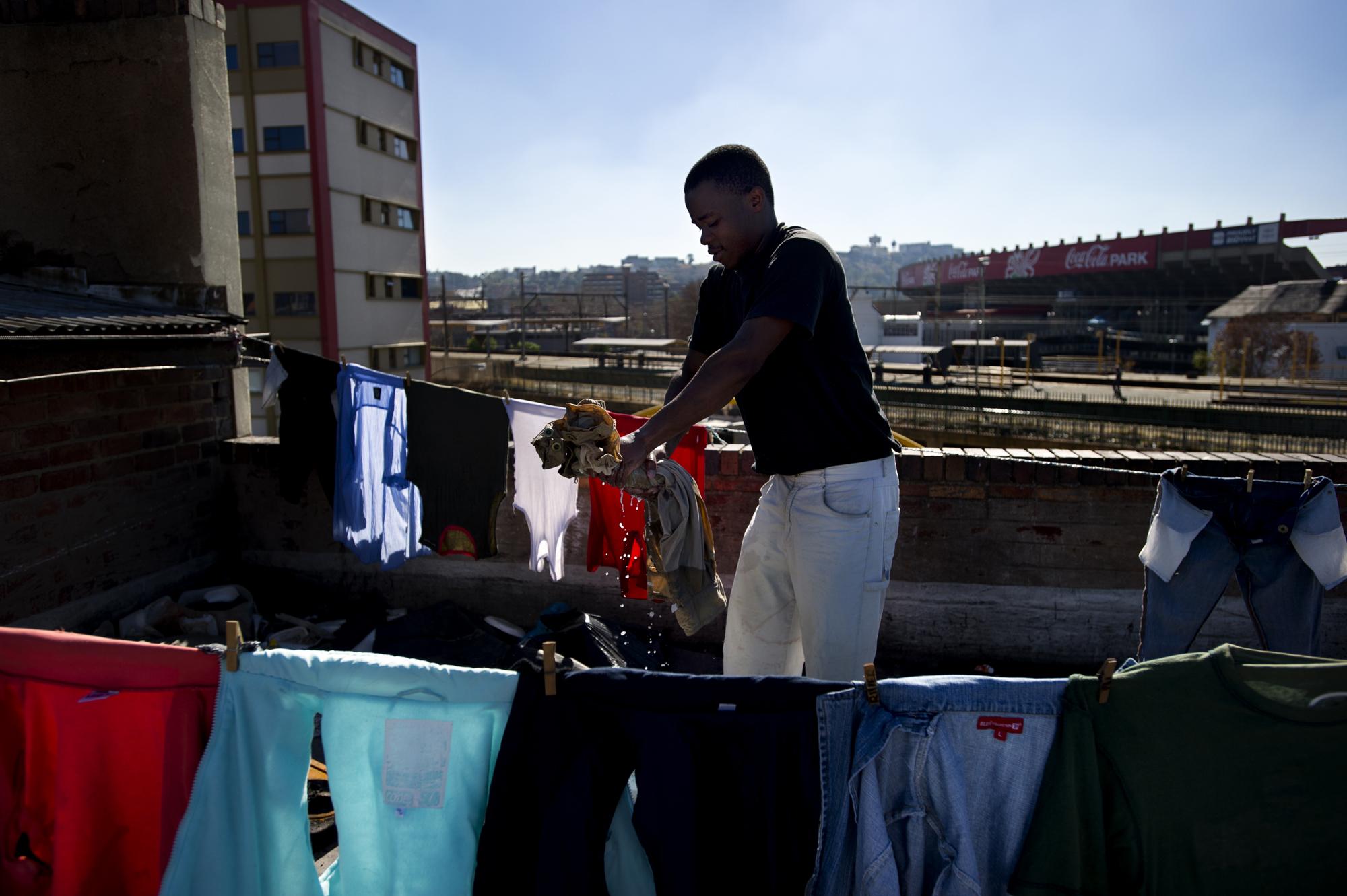 Into the shadows - Johannesburg, South Africa. June 2011. A young Zimbabwean...