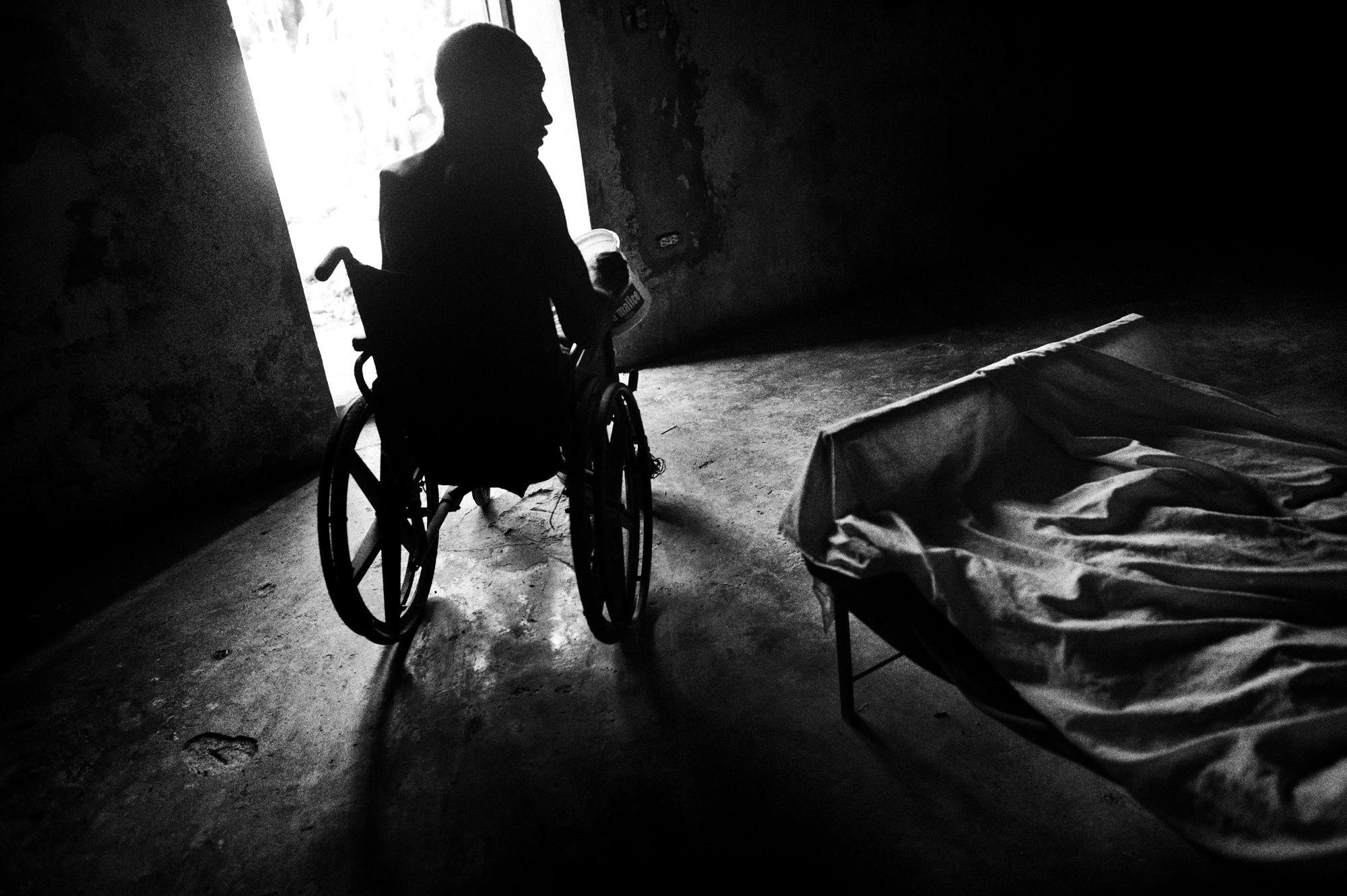 Hospice/ Haiti - Petit Guave, Haiti.
June 2010.
An inmate on a wheel...