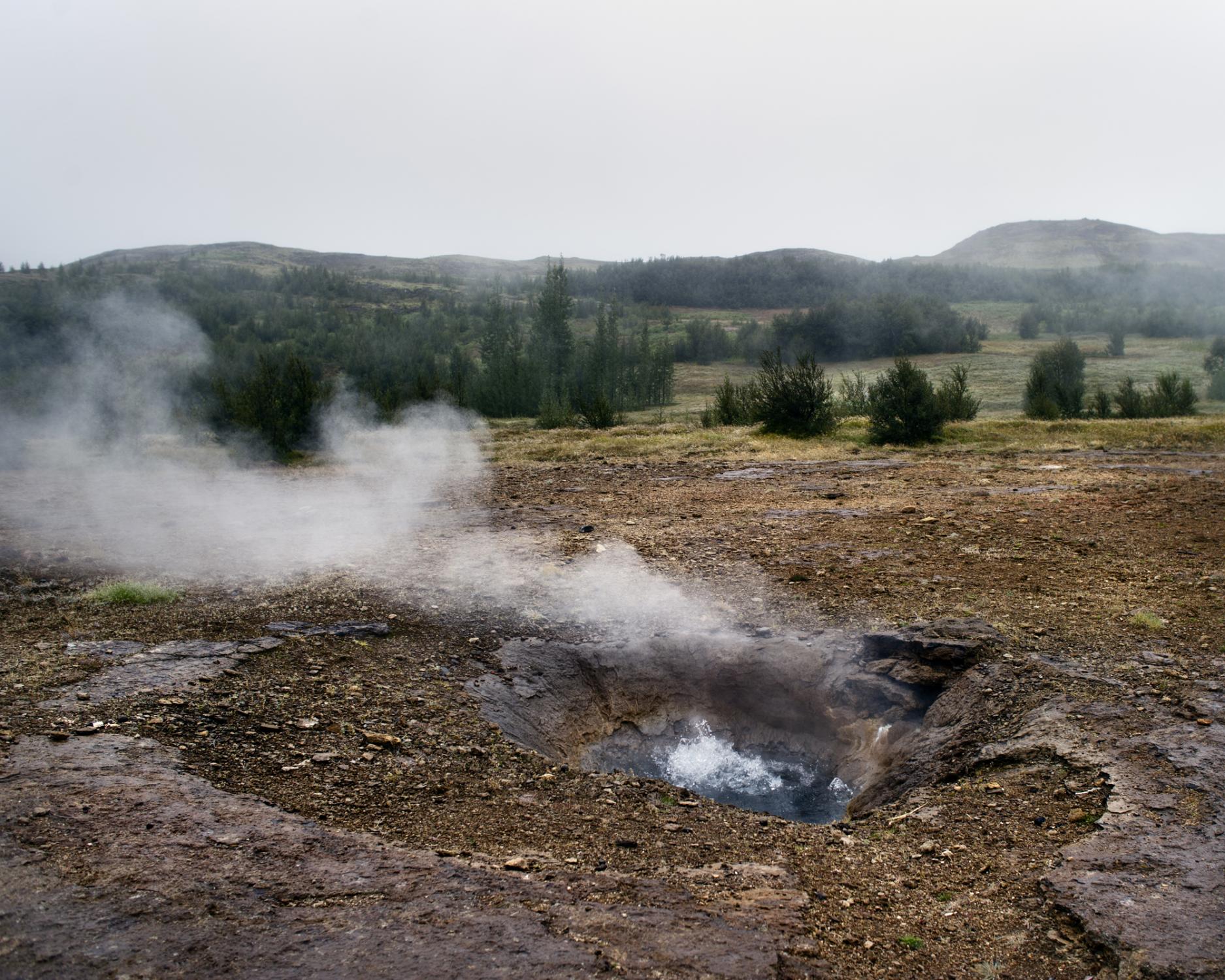 Geothermal Power in Iceland. August 2010. Iceland. Gullfoss Geysir hot spring area. Geothermal energy is the heat energy that occurs naturally in...