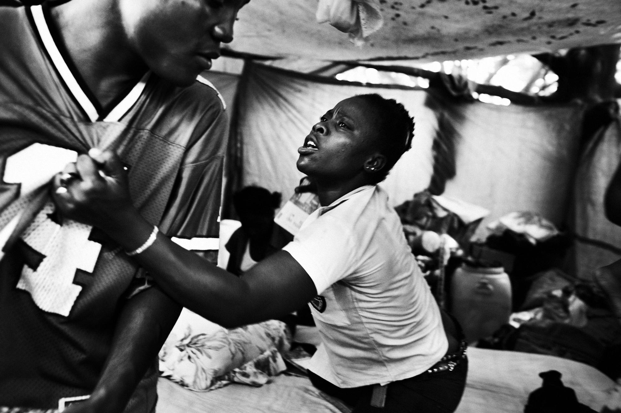 Private hell - Port au Prince.June 2010.A young woman fighting with a...