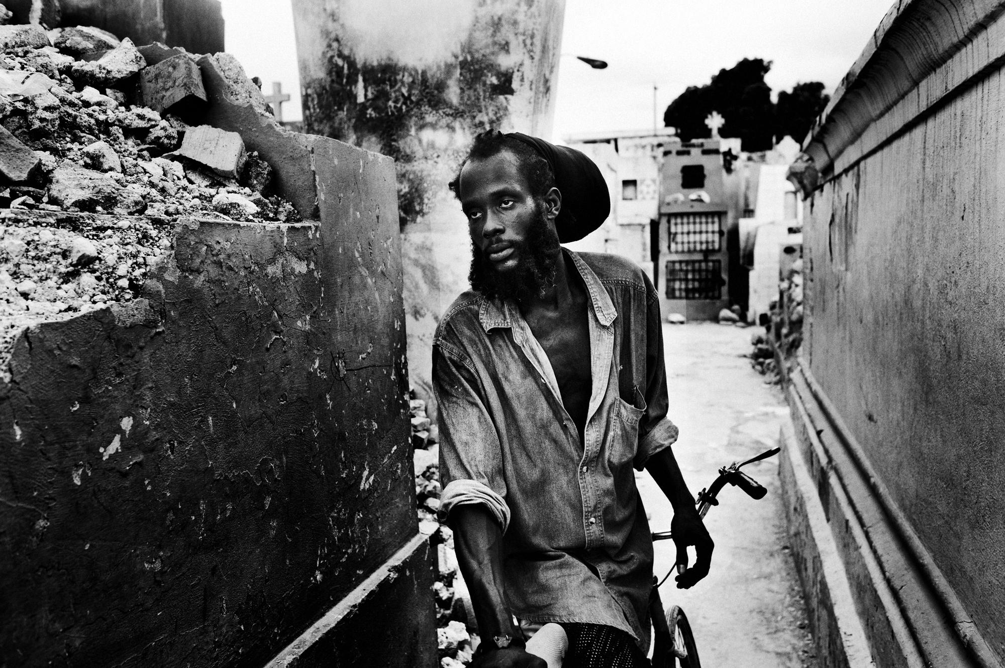 Private hell - Port au Prince.June 2010.A man standing next to the...