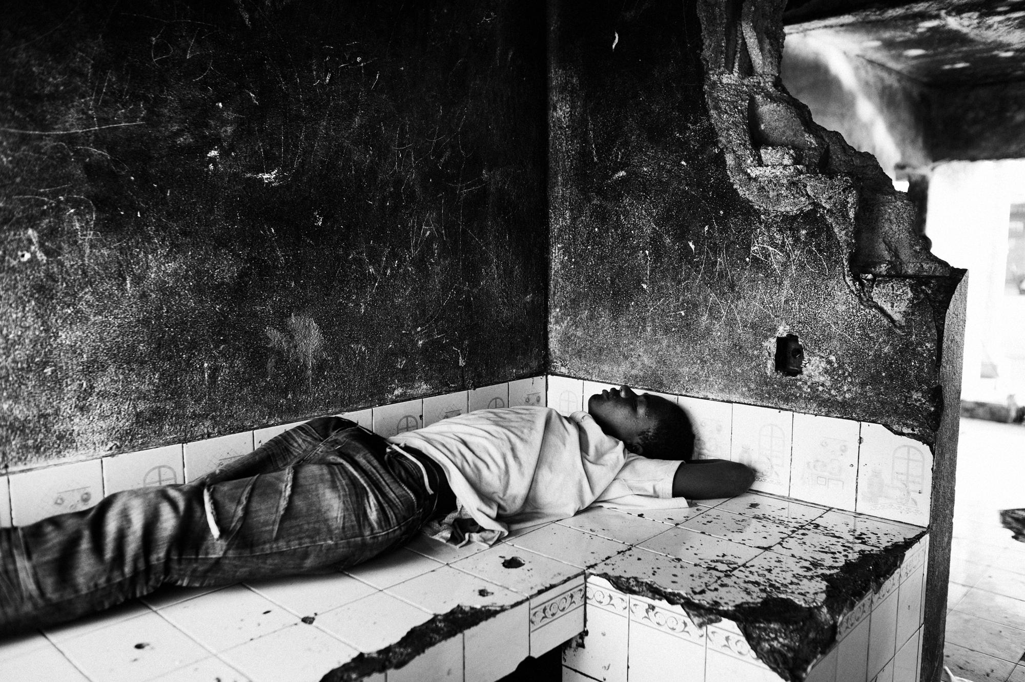 Private hell - Port au Prince.June 2010.A young man sleeping in CitÃ©...