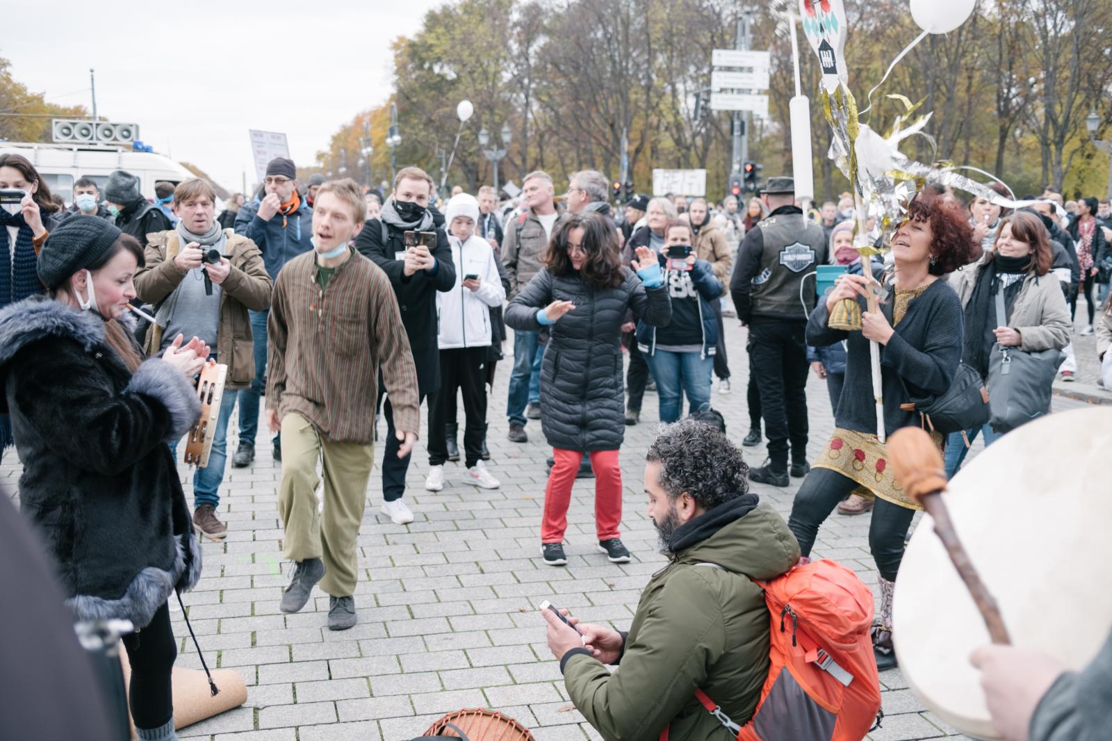 Conspiracy Ideologists rally in Berlin, as new German Infection Protection Act is decided - Dancing and singing.