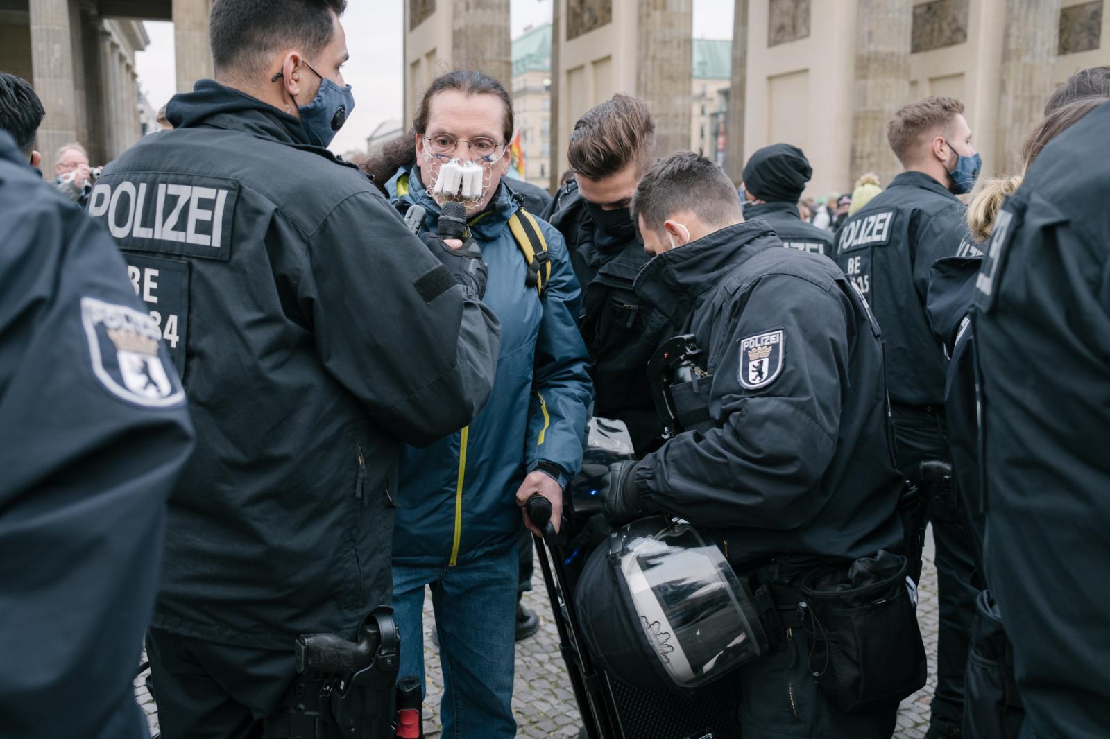 Conspiracy Ideologists rally in Berlin, as new German Infection Protection Act is decided - Police arrest a man pretending to hold a spontaneous...