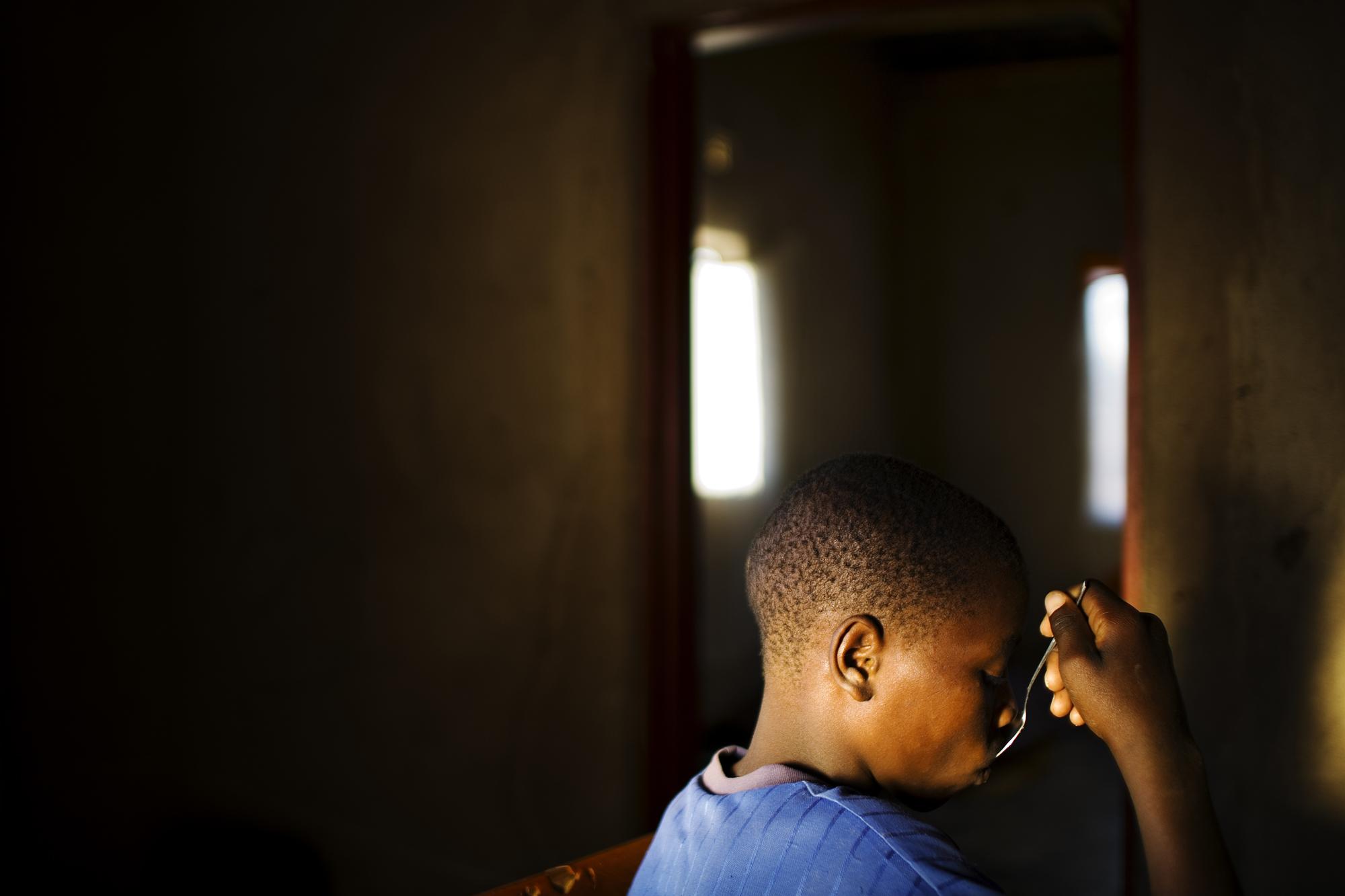 SwazilandÂ´s orphans  - Mbangazuwe, Swaziland. Celani eating. The HIV/AIDS...