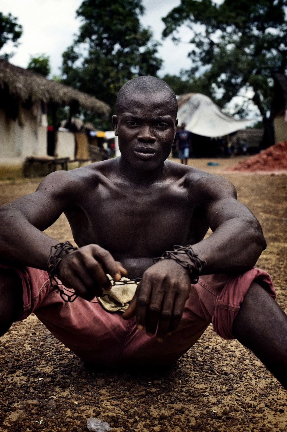 Liberia - Liberia, Manamu
October 2008.
A chained mine worker is...