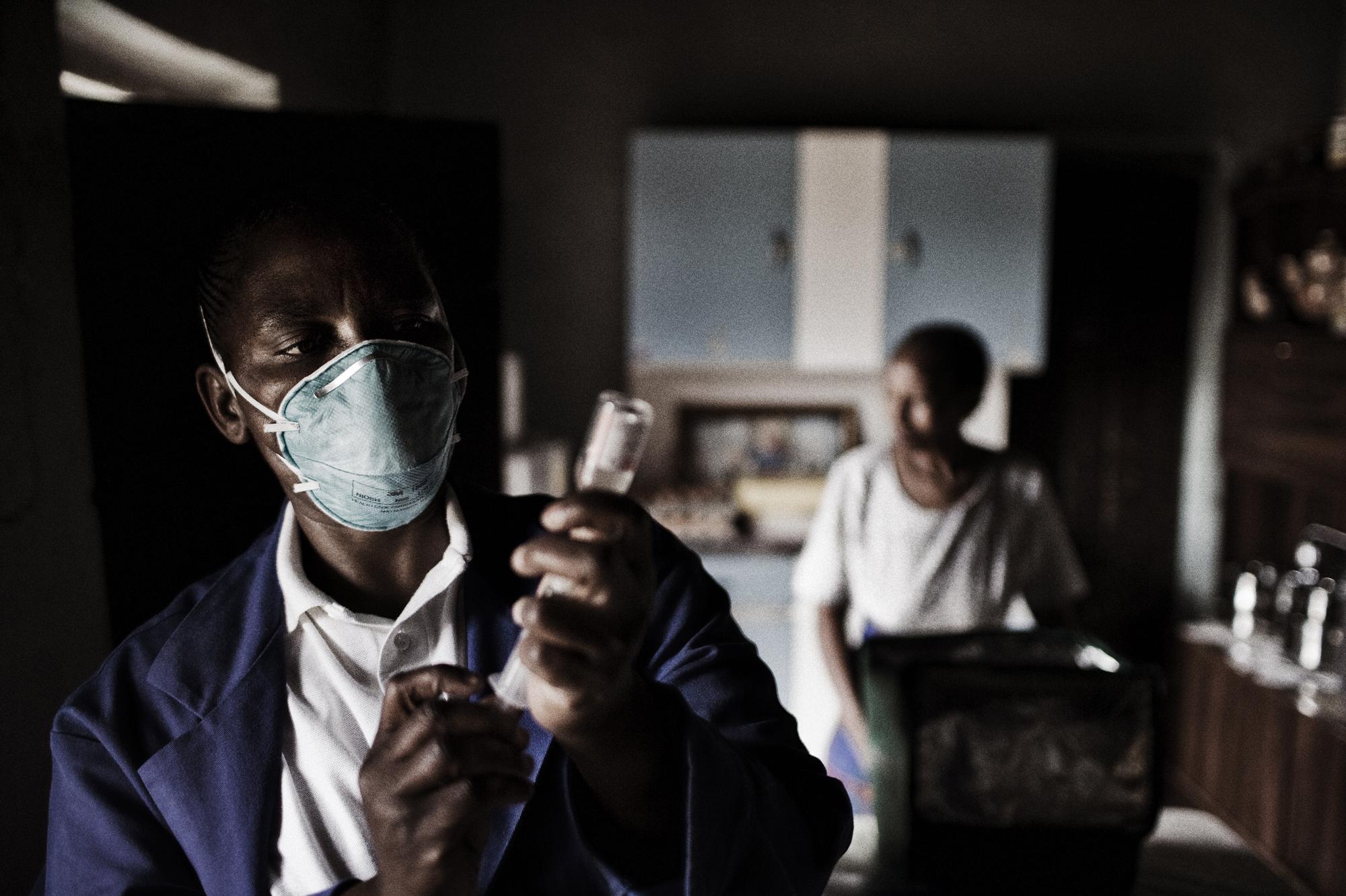 Tuberculosis / Lesotho - Lesotho.
A nurse is preparing the daily vaccination for...