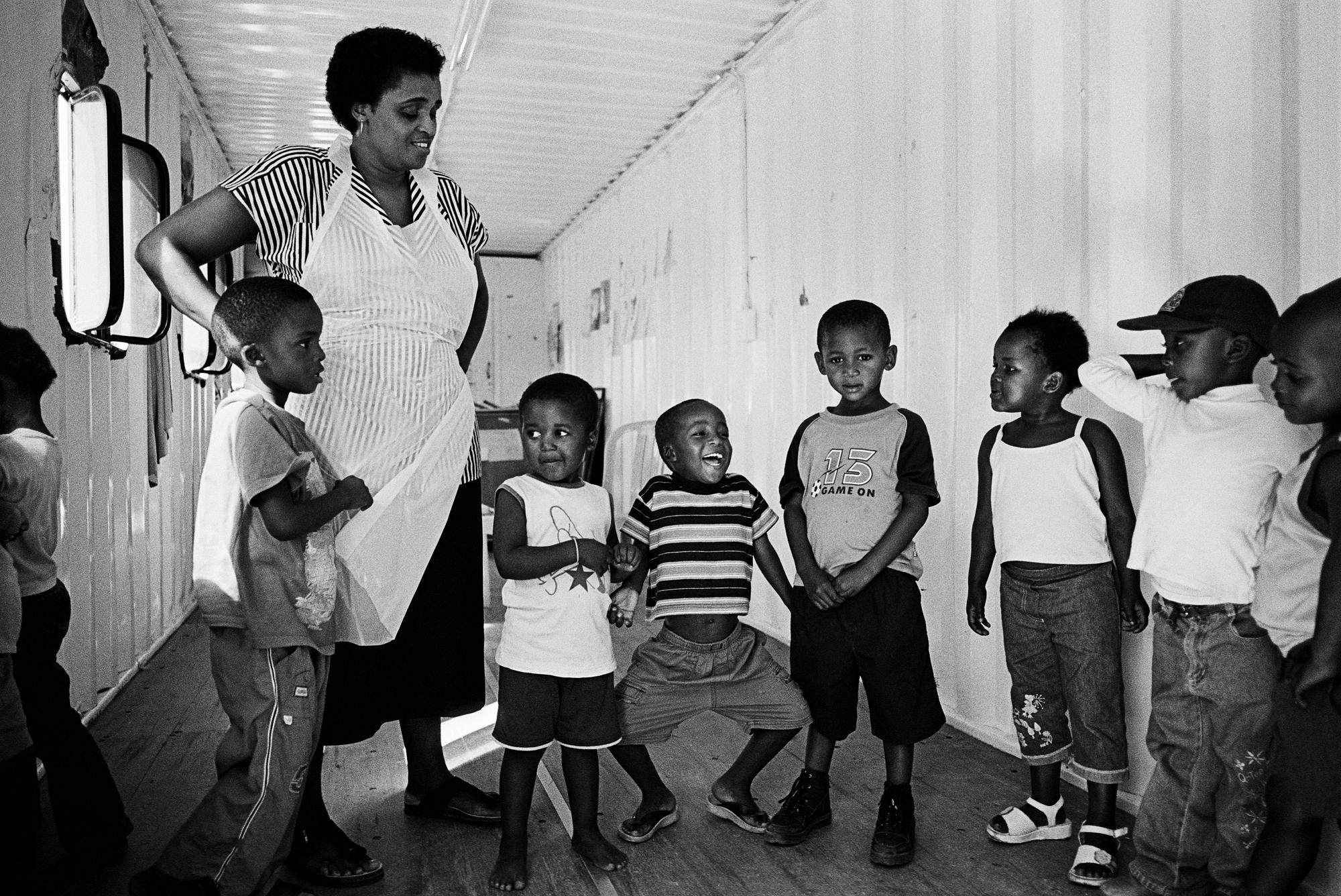 SOUTH AFRICA Khayelitsha Township, Cape Town Orphaned children sing songs at the &lsquo;Lizo Nobanda&rsquo; day care centre. Here children...