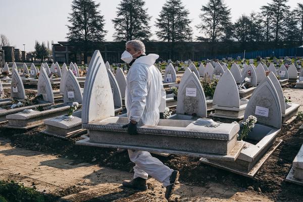 Image from COVID FUNERALS - Gravediggers working in the cemetery of Turin, called...