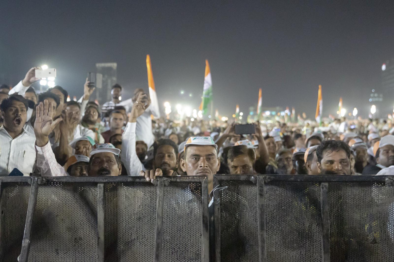 A crowd cheers at a Congress Party rally in Mumbai.