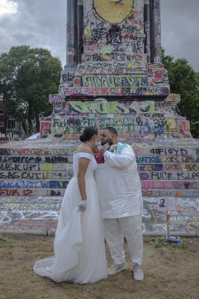 NYT-Monument - RICHMOND, VA - June 20, 2020: Bride Chaela Wilson and...