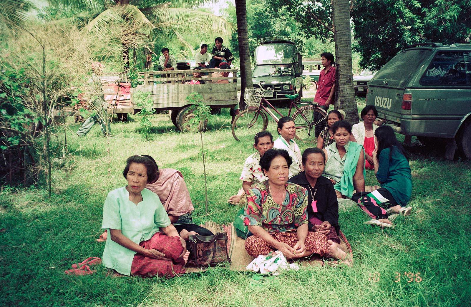 THREE DECADES OF AN ANTI-DAM STRUGGLE - A group of women members of the Assembly of the Poor wait...
