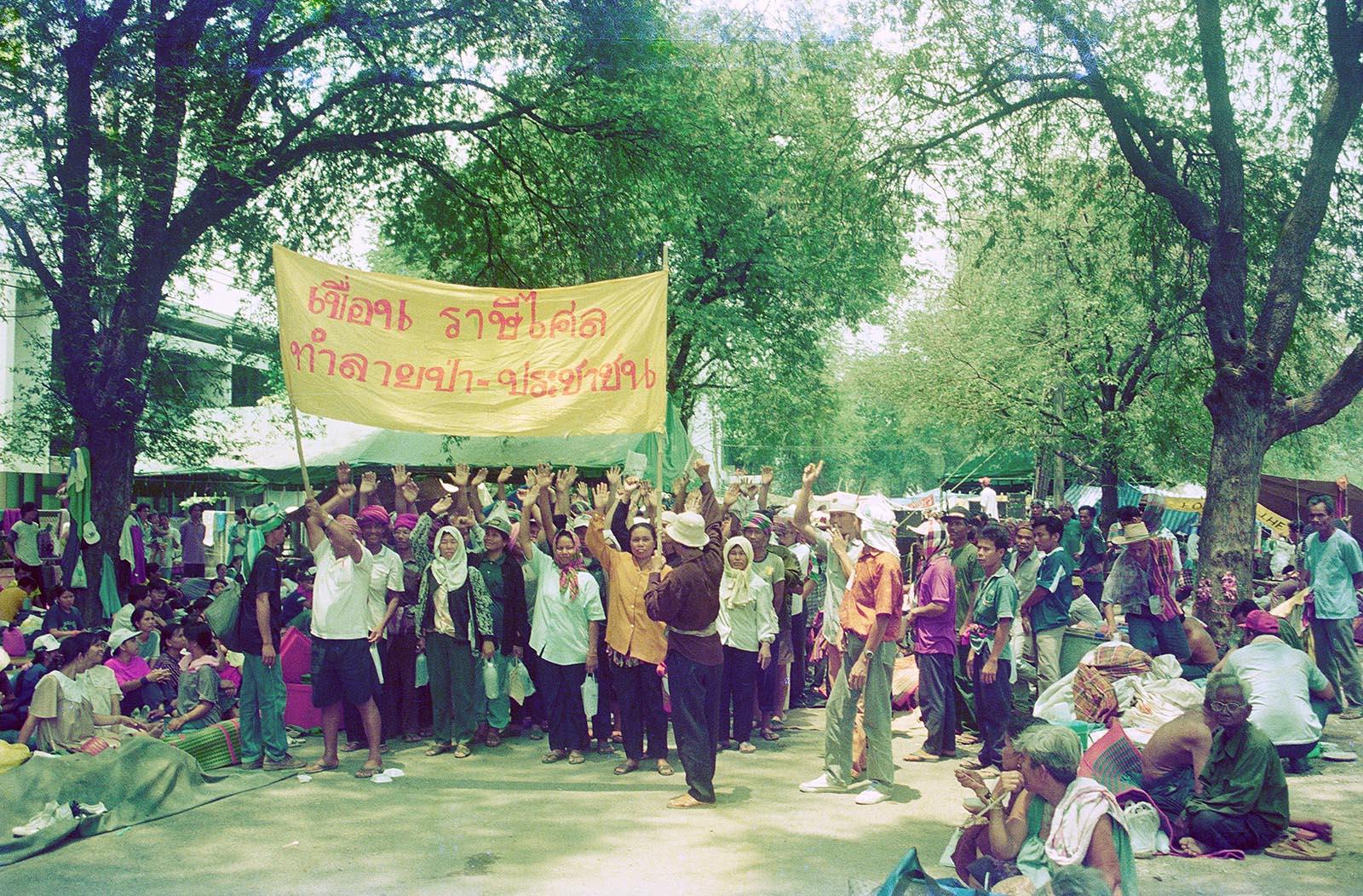 THREE DECADES OF AN ANTI-DAM STRUGGLE - The banner reads "The Rasi Salai dam destroyed our...