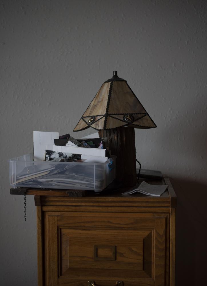 A lamp sits near a tub of photo...uld have a place to congregate.