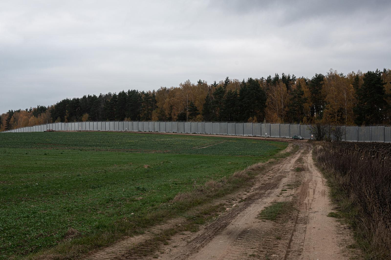 The anti-migration fence, with ...land and Belarus. Krynki Poland