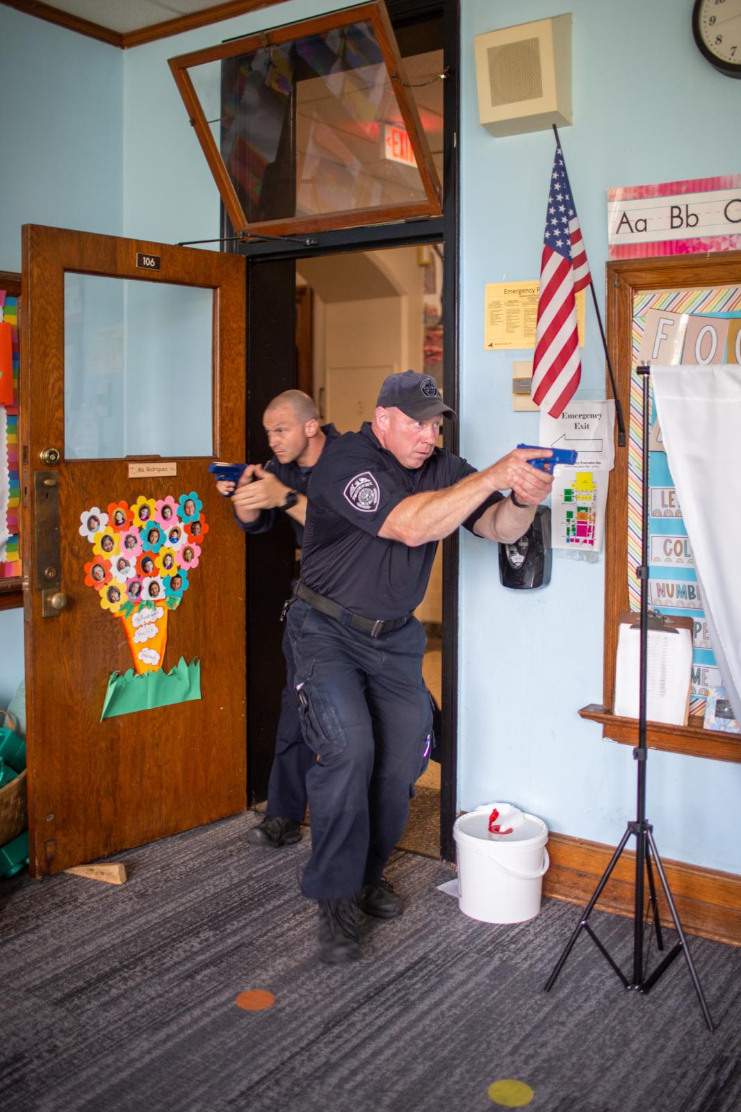 HELL DRILL * Warning: Sensitive Content  - Police officers, Jonathan Jensen (left) and Officer...