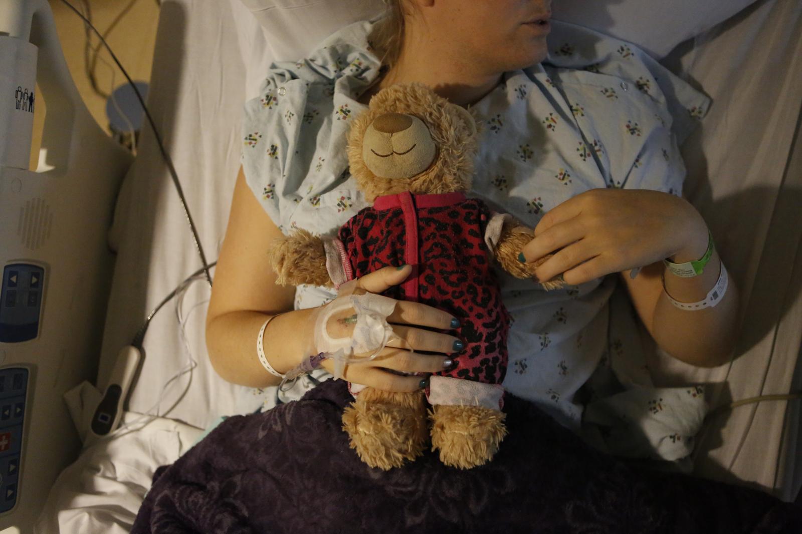 Taylor Miller - Taylor holds her teddy bear as she recovers from gender...